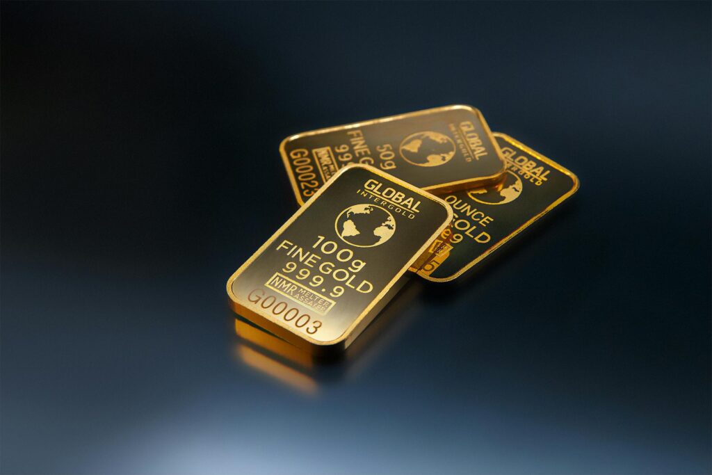 Close-up of gold bars on a dark background, representing wealth and investment opportunities.